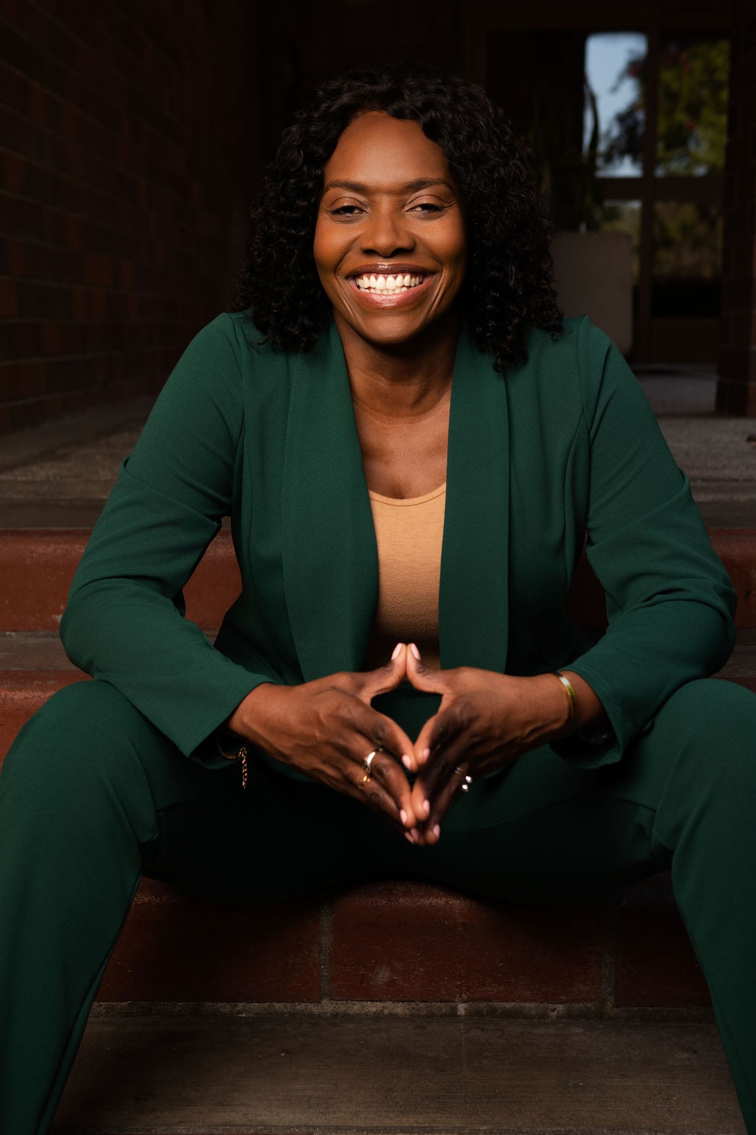 Personal branding photoshoot in Long Beach showing female entrepreneur in professional office setting by Justicee Photography
