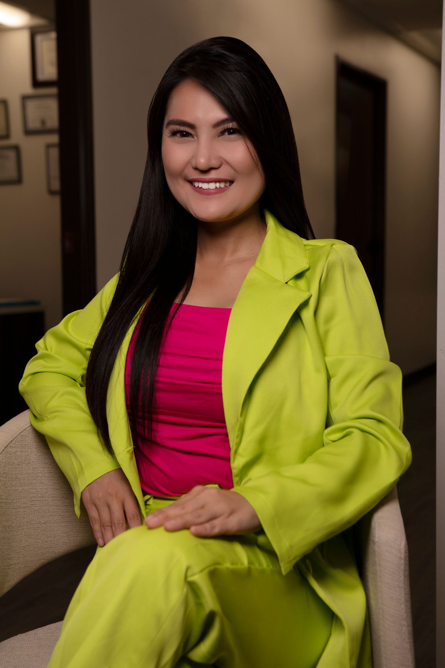Personal branding photoshoot in Long Beach showing female entrepreneur in professional office setting by Justicee Photography