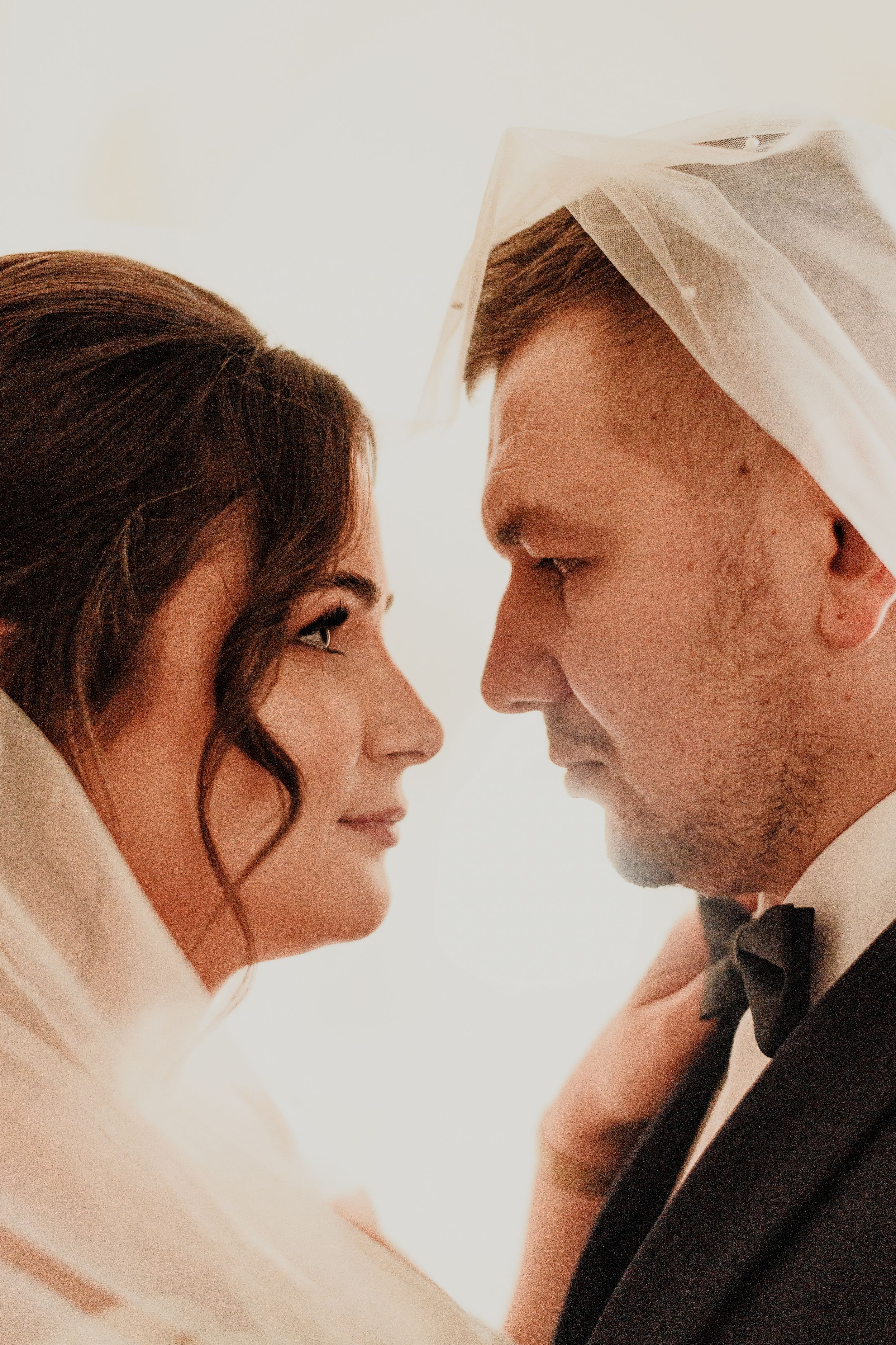 Intimate wedding portrait series showing tender moments between newlyweds.