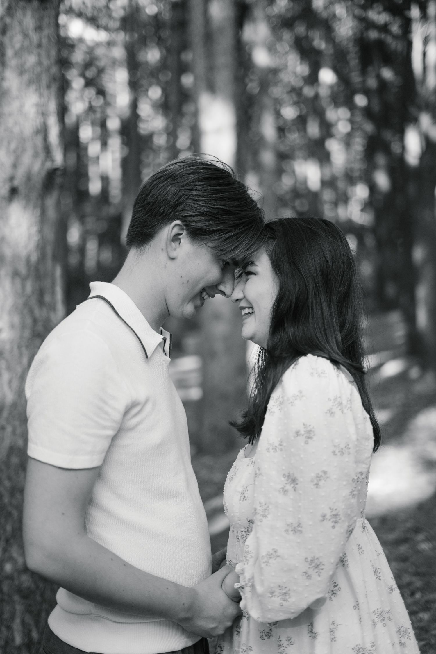 A couple with their heads together.