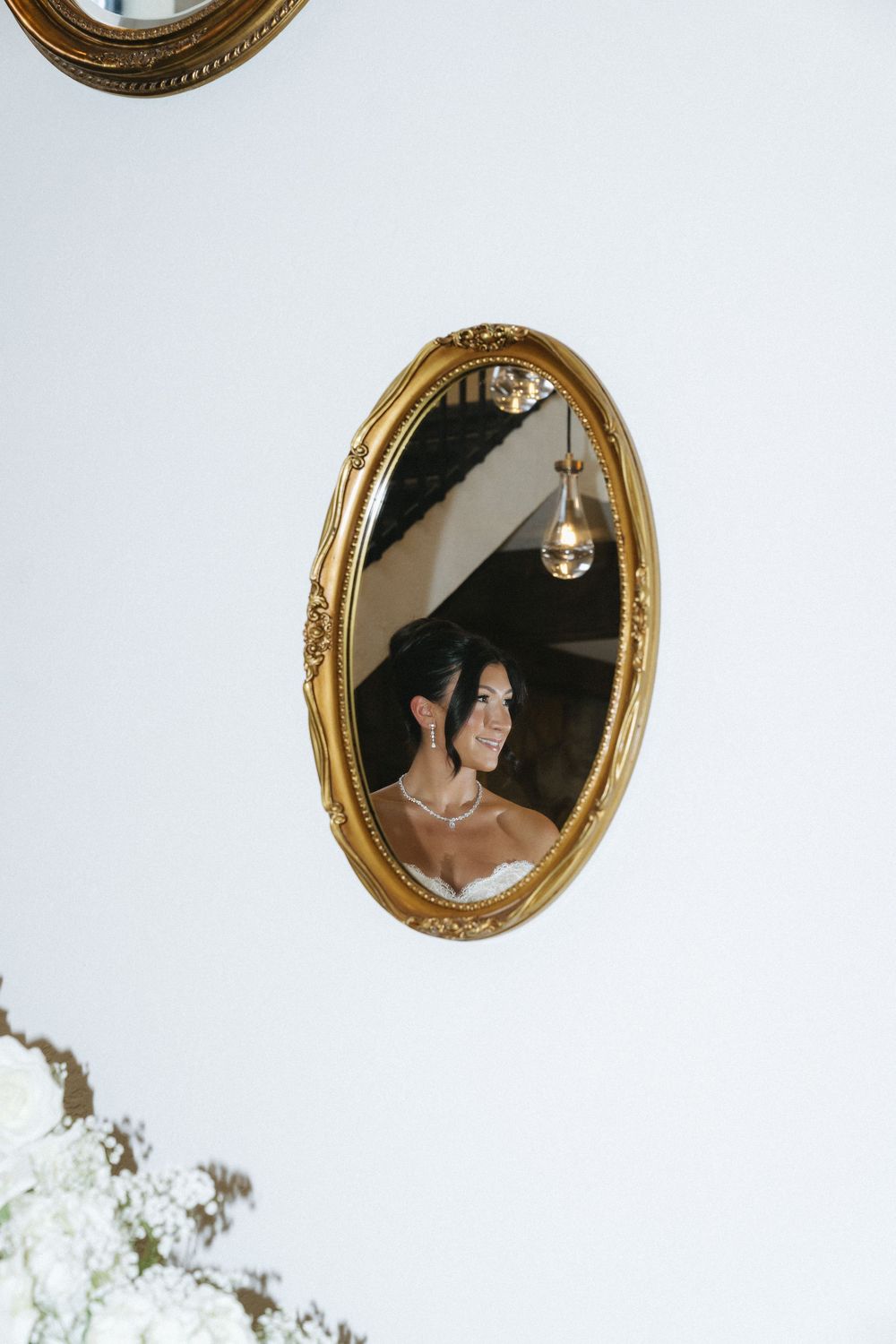 Series of ornate gold mirrors reflecting wedding day preparations.