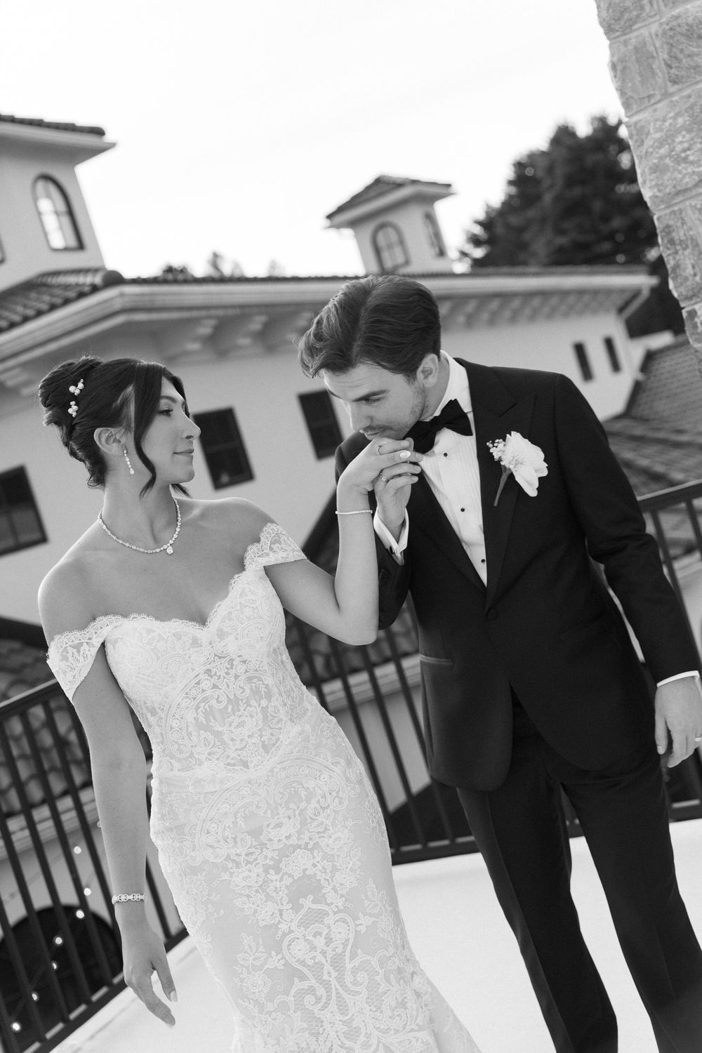 Black and white candid moments between couple on their wedding day.