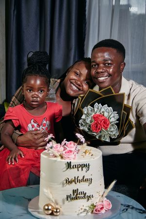 Family portrait at a surprise birthday party