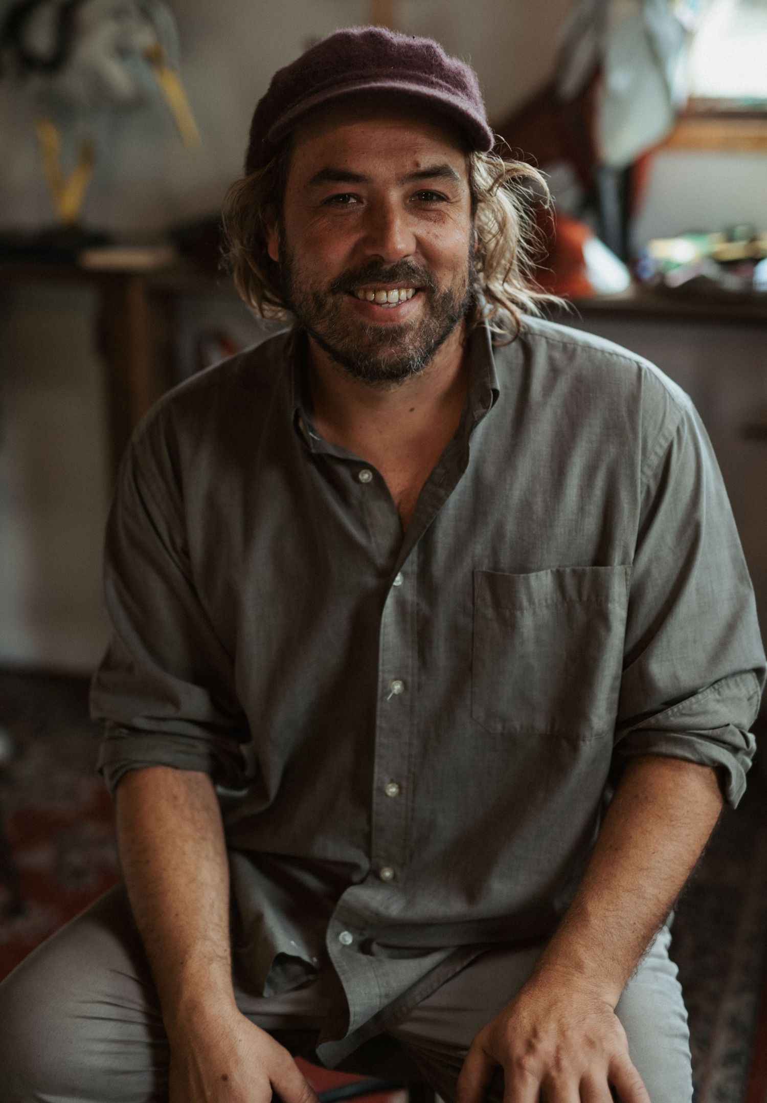 Candid workshop portraits showing craftsman in casual attire.