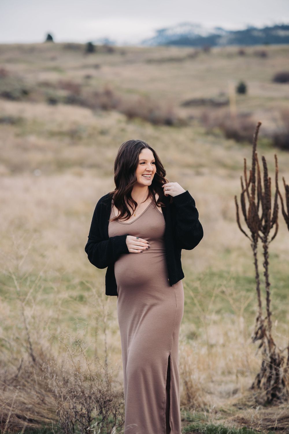 A serene maternity shoot, showcasing the beauty of the Saltese uplands with a glowing expectant mother.