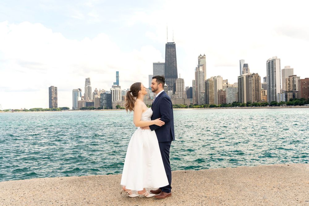 Wedding photos with Chicago skyline and Lake Michigan creating a stunning backdrop.