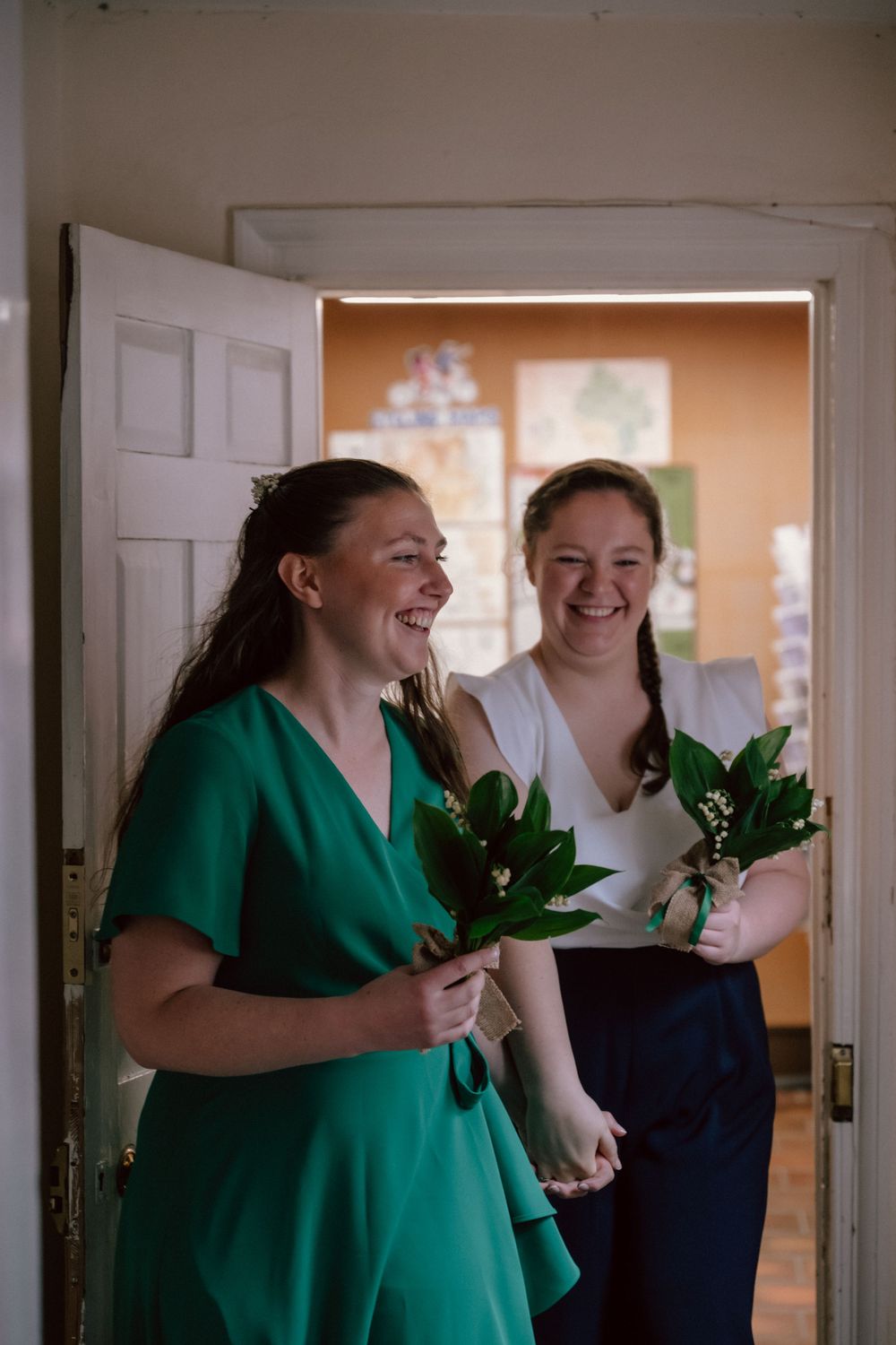 Two people sharing a joyful moment ahead of their wedding ceremony in Ledbury registry office.