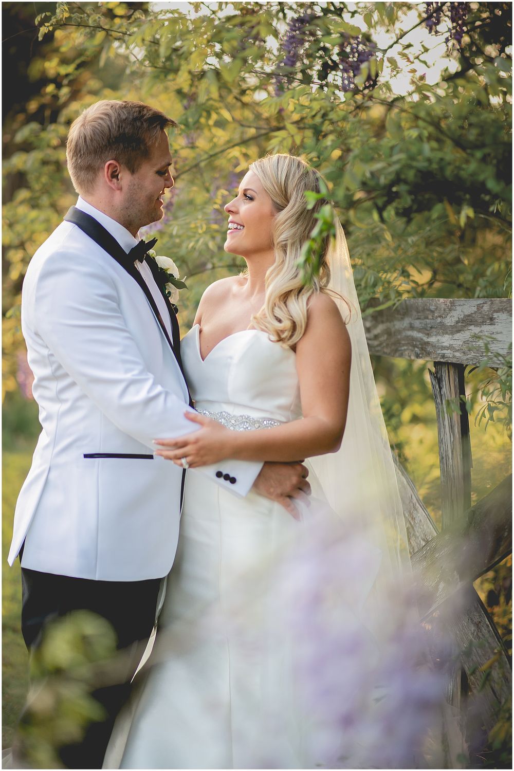A couple in wedding attire share romantic moments outdoors under autumn foliage in a series of candid shots.