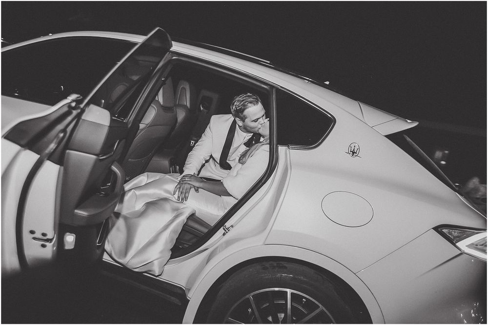 A series of black and white photographs showing different angles of a luxury car with open doors and interior details.