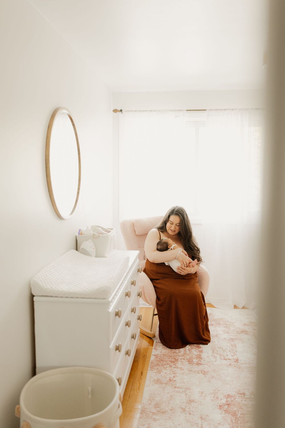 A sequence of minimalist photographs showing someone relaxing on a white bed with a brown sweater and floral rug.