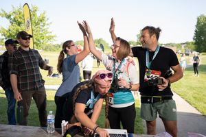 Runners celebrating results, branding images for a running company.