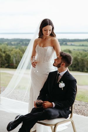 Bride and groom pose overlooking Bay of Fundy, Nova Scotia fine art wedding photographer, Hopewell Highlands wedding photography editorial