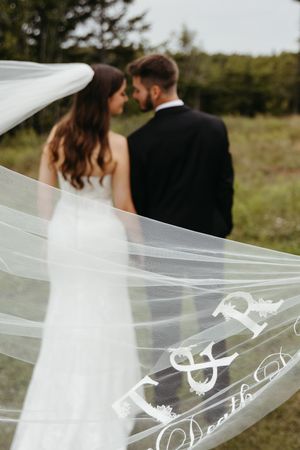 Bride and groom with custom veil at Hopewell Highlands wedding venue New Brunswick wedding photography packages near me editorial fine art