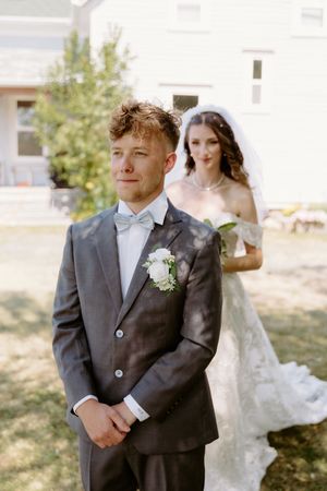 Bride and groom first look in outdoor summer wedding in Nova Scotia, Halifax wedding photographer luxury wedding packages in Maritimes