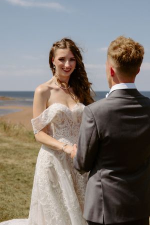 bride and groom exchange vows during intimate summer beach wedding in Nova Scotia, Halifax wedding photographer, full sun wedding photos