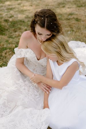 bride and her daughter share intimate emotional moment during backyard summer wedding in Nova Scotia, Halifax wedding photography packages