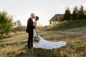 bride and groom kiss at sunset, Farmer Brown's Greenhouse in New Brunswick, garden greenhouse wedding photography in Moncton, luxury photos