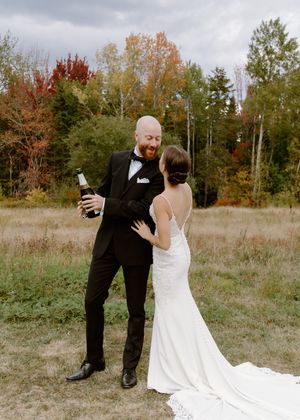 bride and groom candid moment photography in New Brunswick, champagne toast outdoor fall wedding in St. Andrews, Algonquin wedding photos