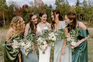 bride and bridesmaids laugh during candid moment, fall wedding photography in New Brunswick, Moncton photographer experienced freelance