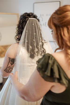 Bride getting ready portraits putting on her veil in Nova Scotia wedding photographer, Maritime wedding, Atlantic Canada wedding photography