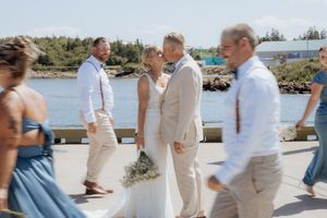 bride and groom wedding party portraits in New Brunswick, beach front summer wedding in full sun, natural light photographer Moncton