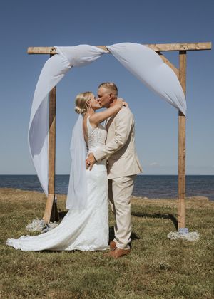 Bride and groom's first kiss wedding ceremony photography New Brunswick, full sun natural light wedding photography Moncton