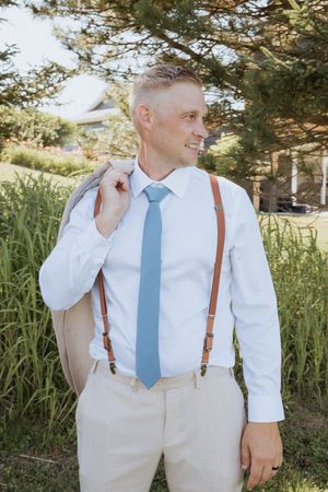 Groom portraits wedding day photography outdoor summer wedding in Cap Pele New Brunswick photographer packages with two photographers