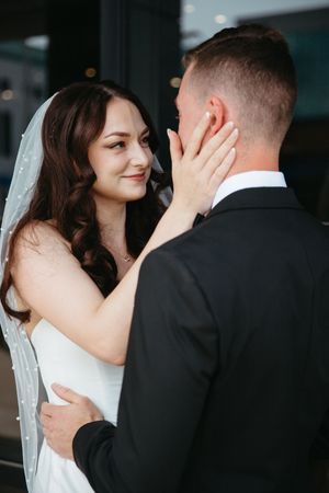 bride and groom candid moment during first look, emotional first look at CANVAS hotel in Moncton New Brunswick elopement photographer