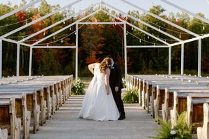Bride and groom kiss at sunset under fairy lights at the Grand Ivory in Moncton New Brunswick, fall wedding photographer in Atlantic Canada