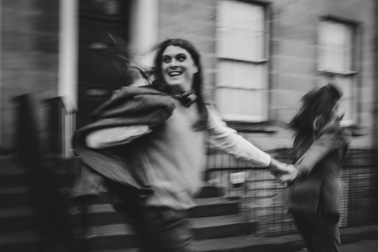 Scottish Elopement Photographer - couple running through the streets of edinburgh