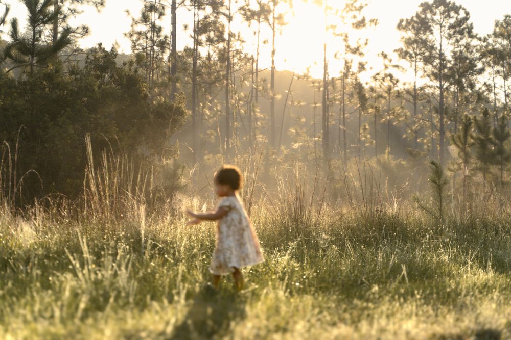 Joyful birthday portrait surrounded by greenery