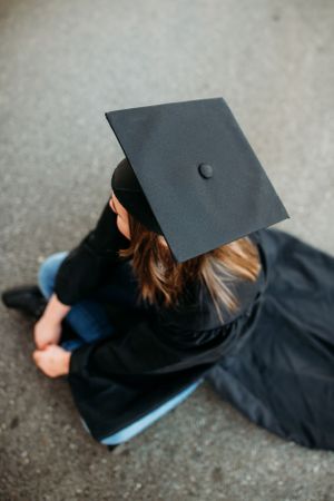 Overhead view of cap on girls head for senior session photography. Captured by Maryland Photographer Mallory Bramlett.