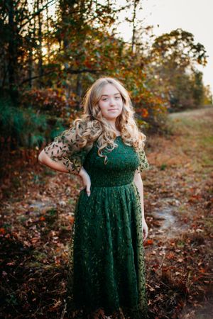 Girl in field for senior session photography. Captured by Maryland Photographer Mallory Bramlett.