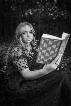 Girl reading book for senior session photography. Captured by Maryland Photographer Mallory Bramlett.
