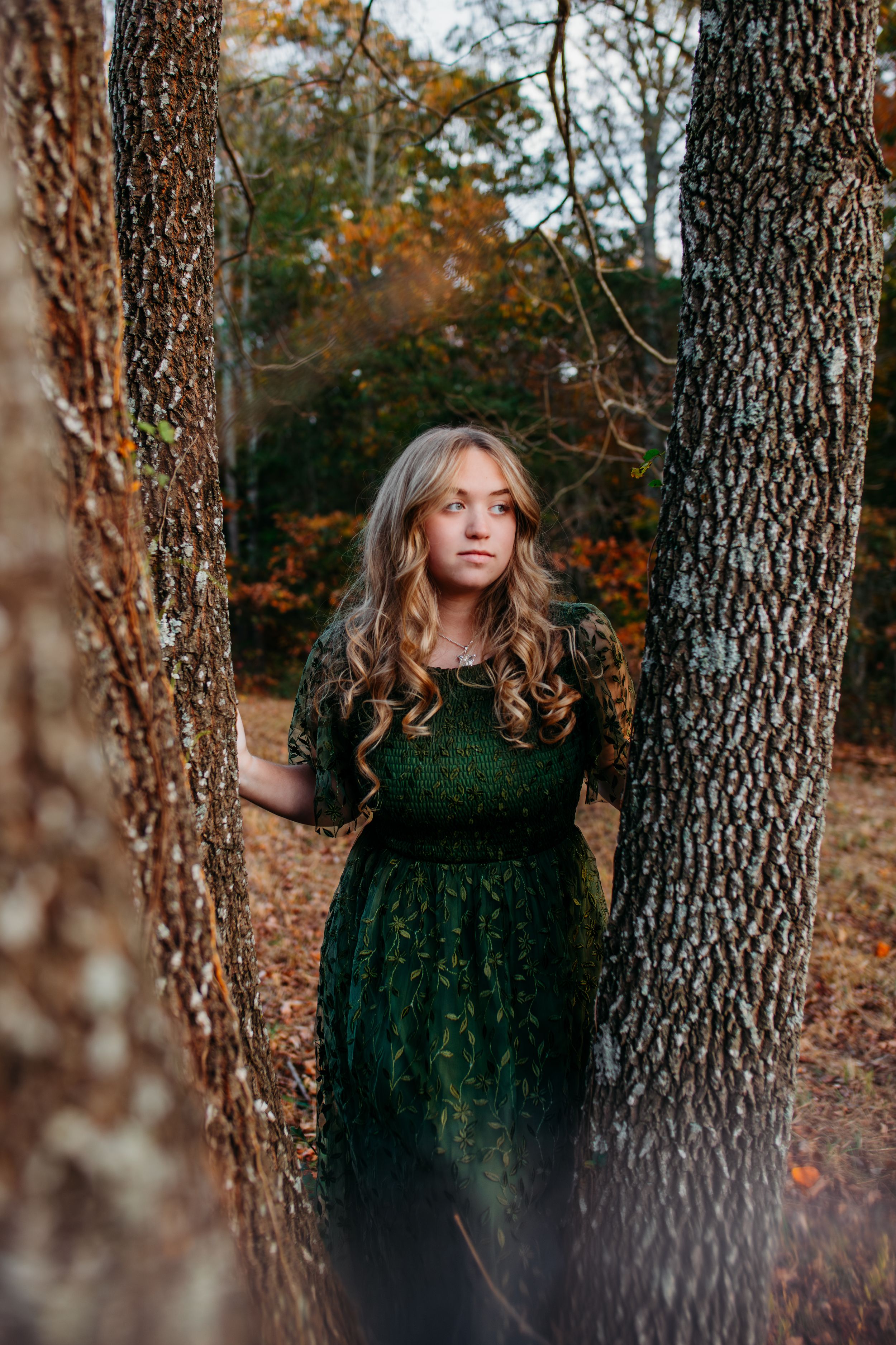 Girl in field for senior session photography. Captured by Maryland Photographer Mallory Bramlett.