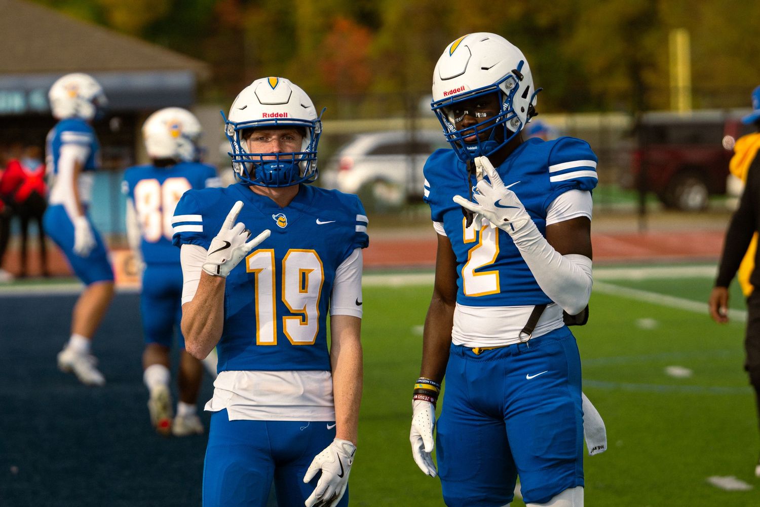 Madonna wide receivers posing for social media during pregame warm ups, Madonna vs IWU, Livonia Stevenson HS, Livonia MI, 10/18/25