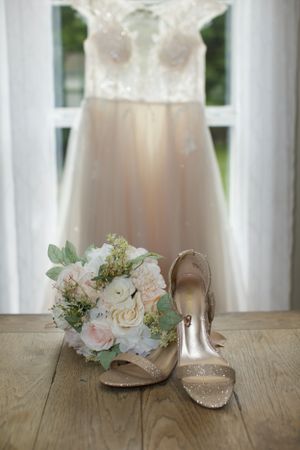 New England wedding and lifestyle photographer. 
details image.  wedding dress. wedding shoes   wedding bouquet