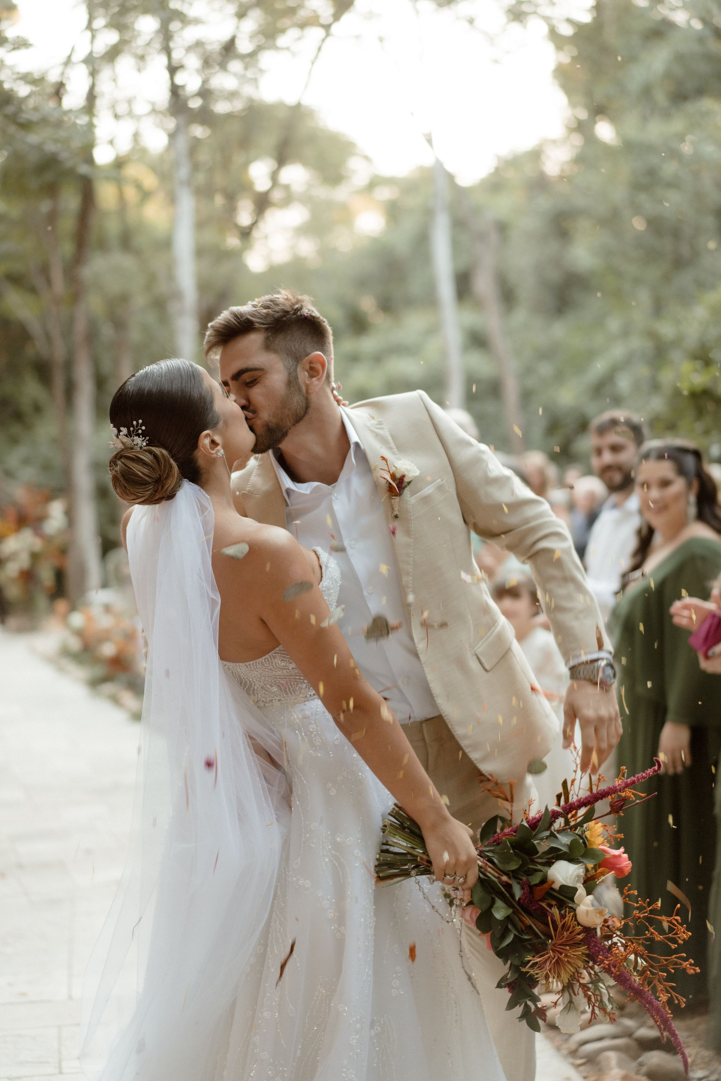 Romantic dance sequence at outdoor autumn wedding with flowing white dress.
