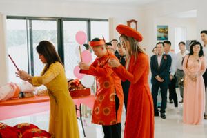 Bride and groom bowing during wedding tea ceremony  brisbane wedding