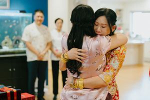 emotional hug at tea ceremony in Brisbane