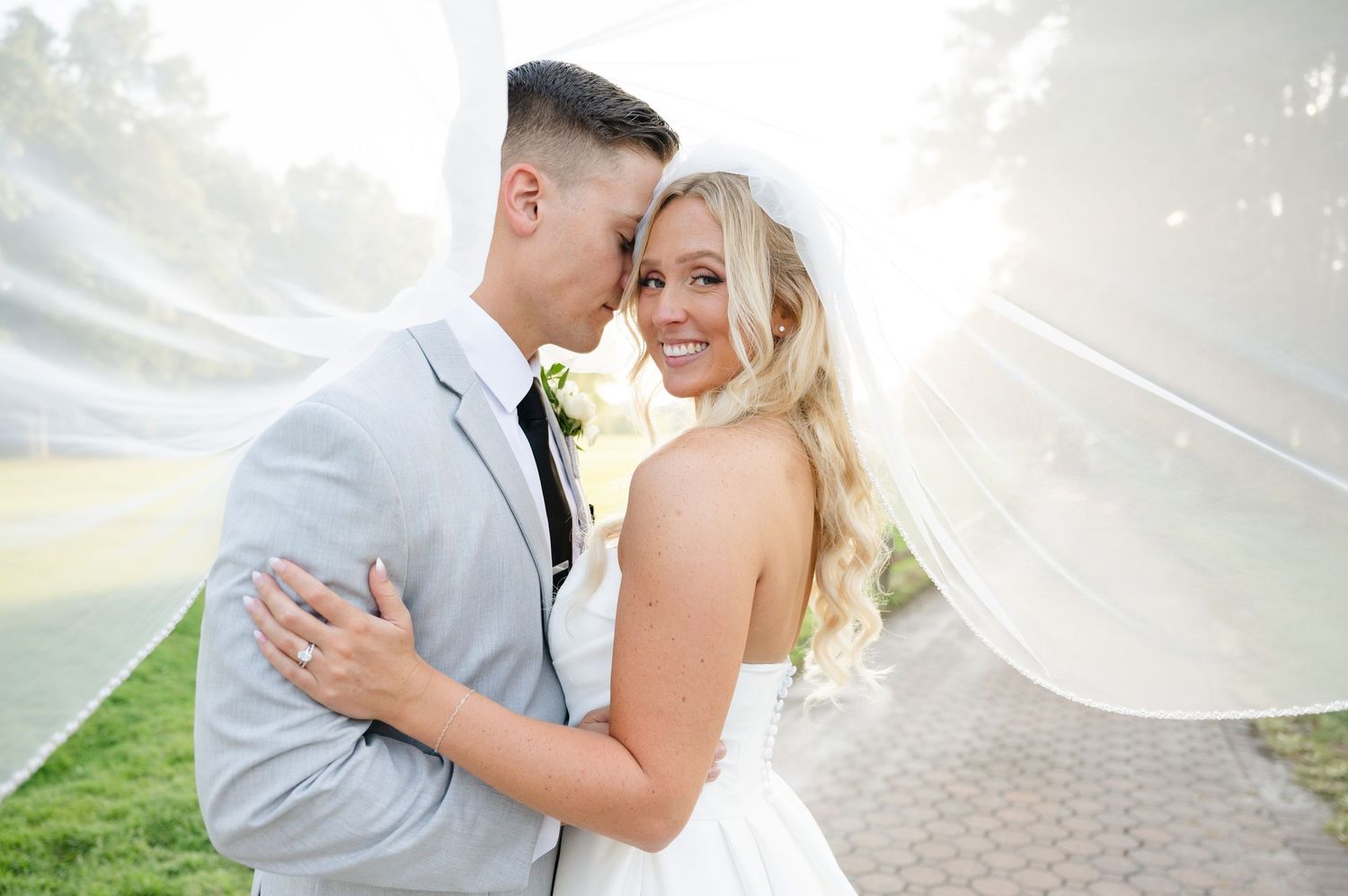 Bride and Groom under wedding veil
