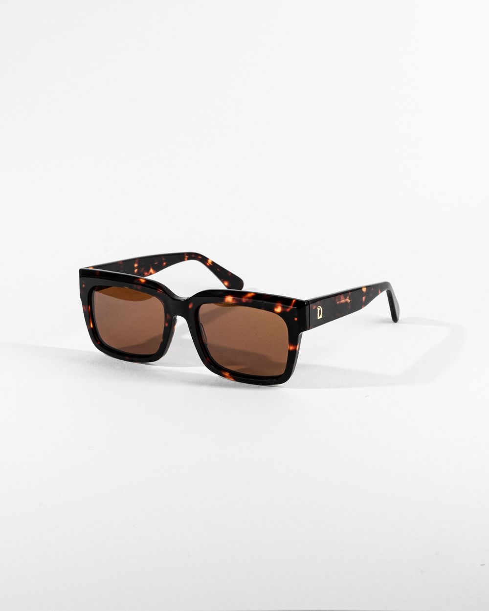 Tortoiseshell square sunglasses with brown lenses shot on clean white background. Mtlshutter photography
