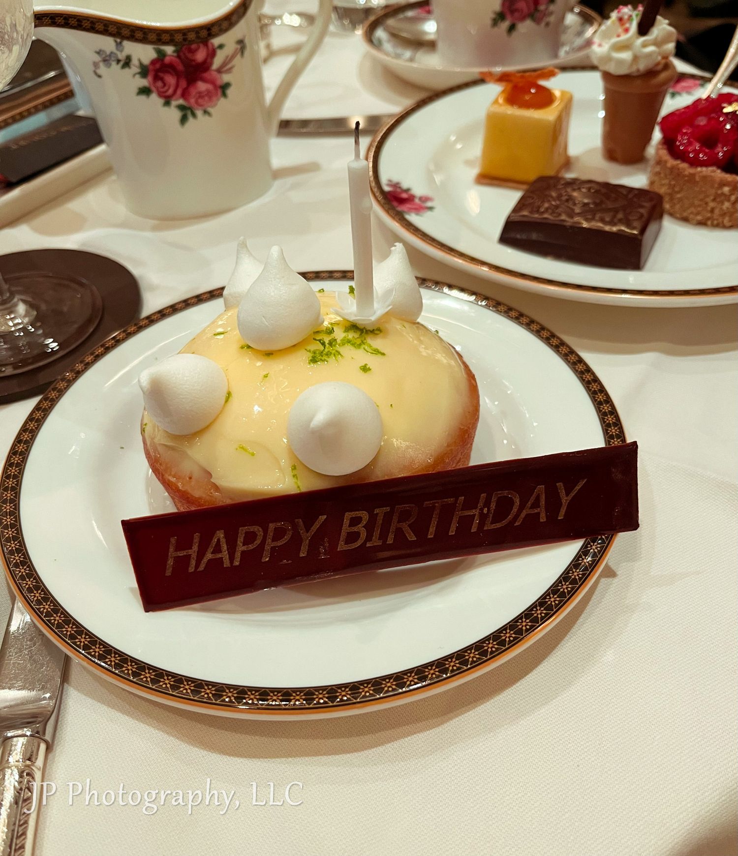Elegant dessert plates featuring chocolate and vanilla pastries with Happy Birthday message.