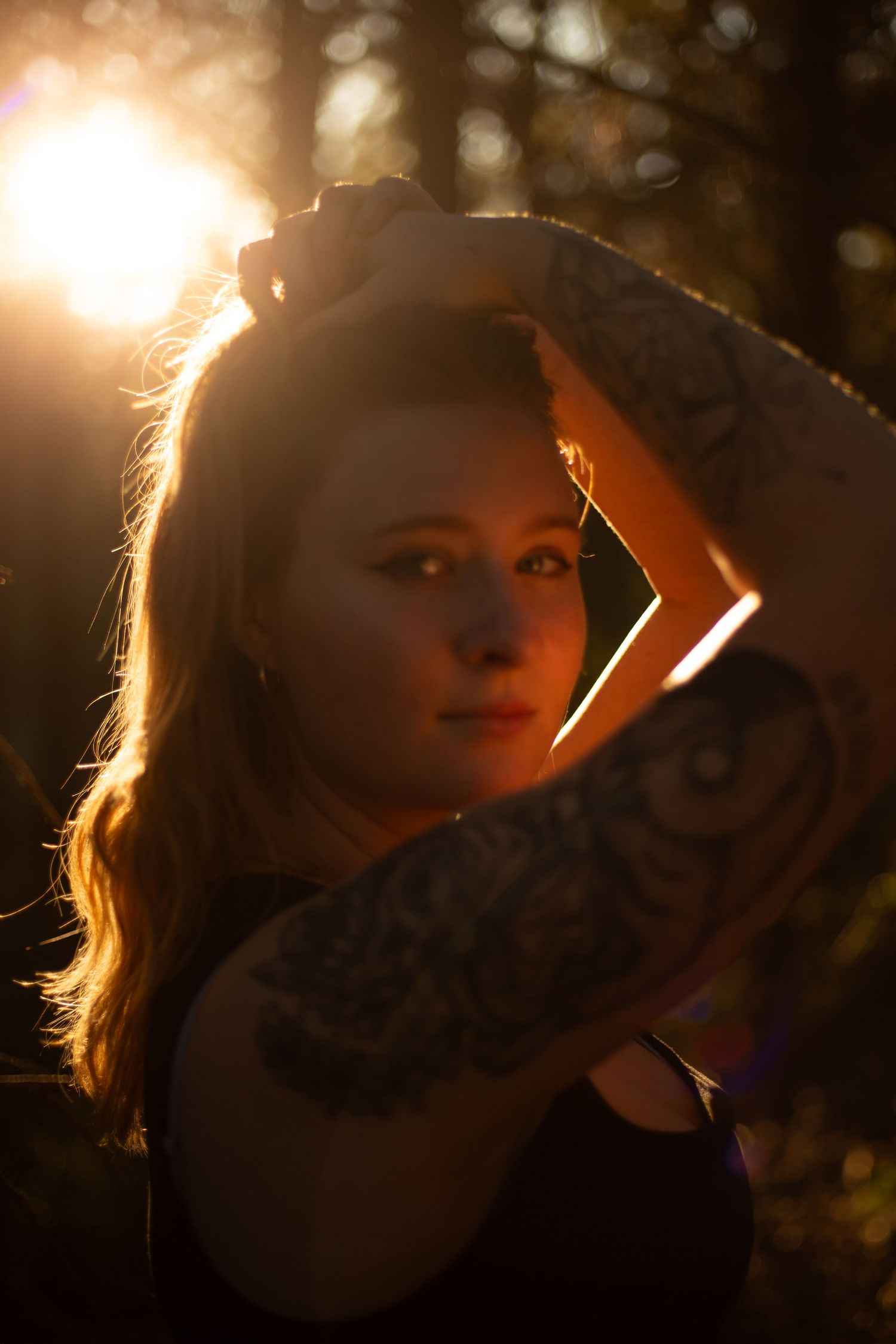 A person silhouetted in golden backlight strikes dramatic poses in a series of portrait shots.