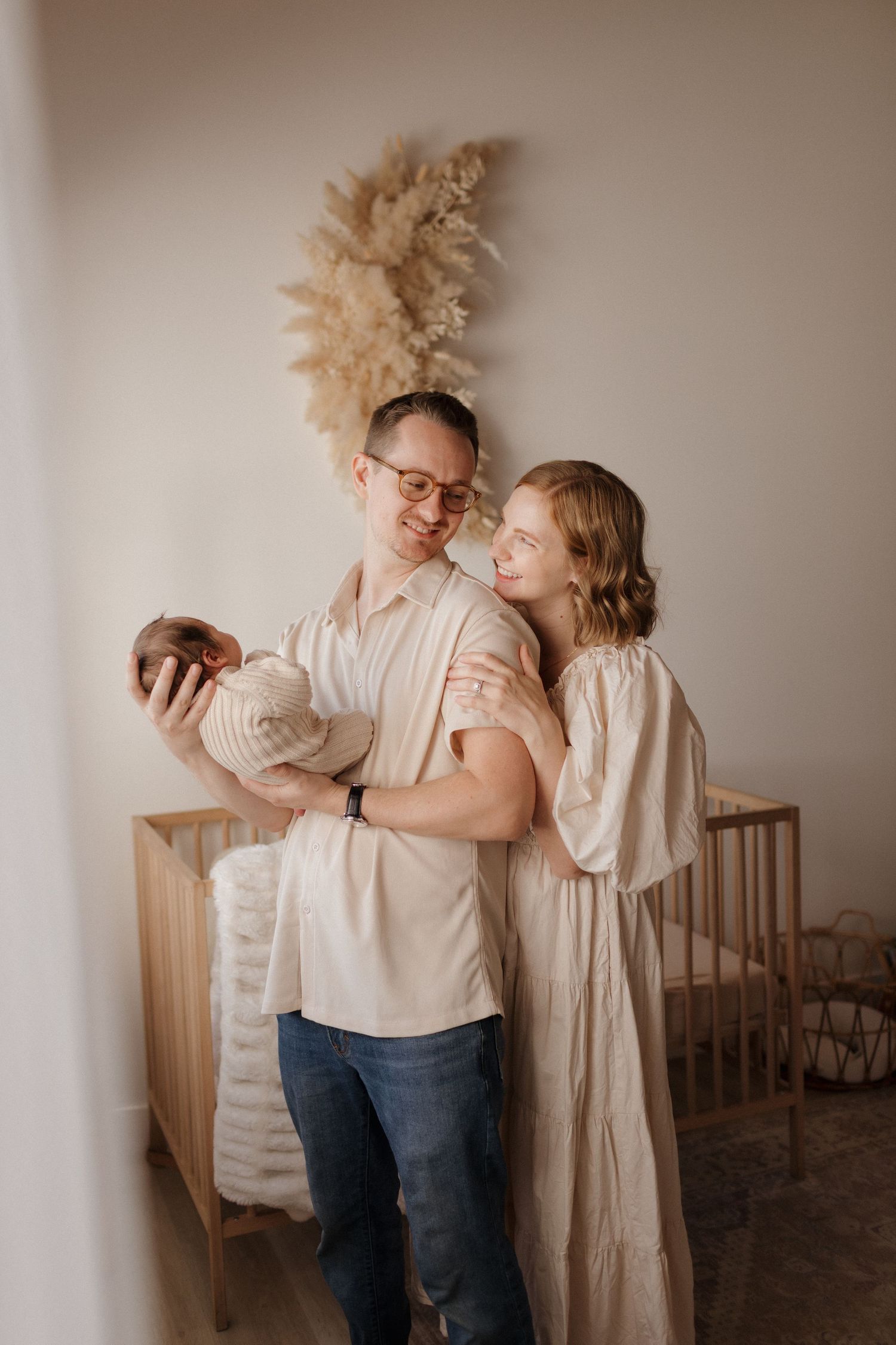A nursery scene with elevated wardrobe and warm neutral tones.