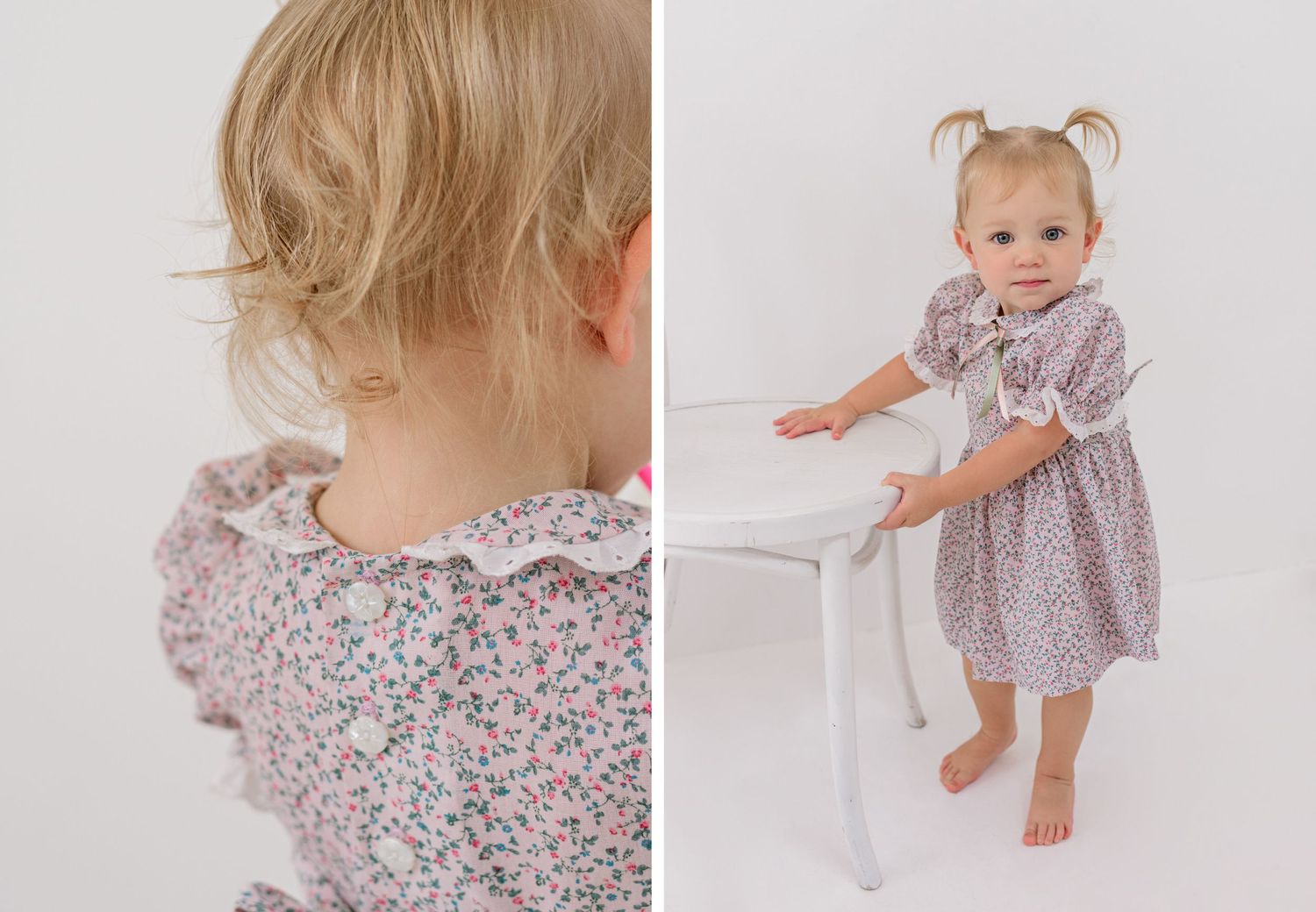 Toddler in a floral patterned dress with ruffled sleeves shown from behind and in a standing pose against white backdrop.