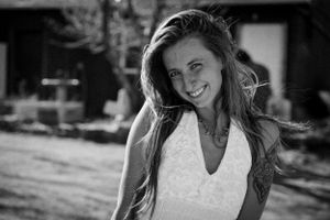 Black and white outdoor portrait showing natural joy and movement.