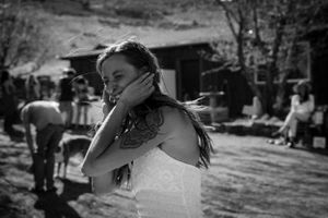 Black and white candid moment captured in natural outdoor setting.