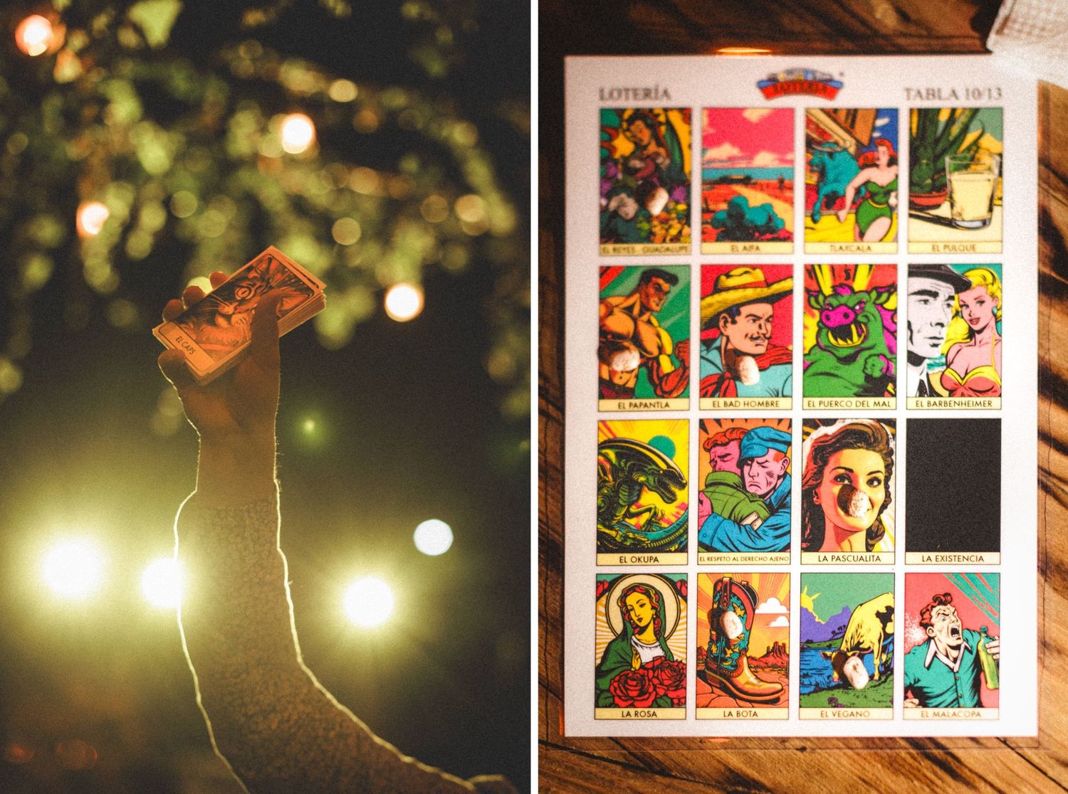 A collection of colorful loteria cards beside a warm glowing light in the dark with bokeh effect.