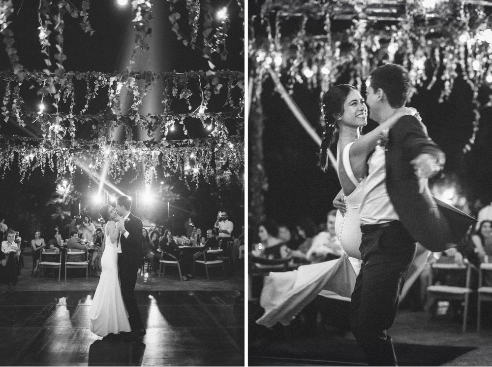 A wedding couple shares their first dance together under romantic string lights at an elegant outdoor evening reception.